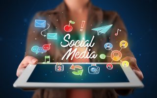 casual-young-woman-holding-tablet-with-social-medi-2025-10-13-03-10-42-utc-scaled